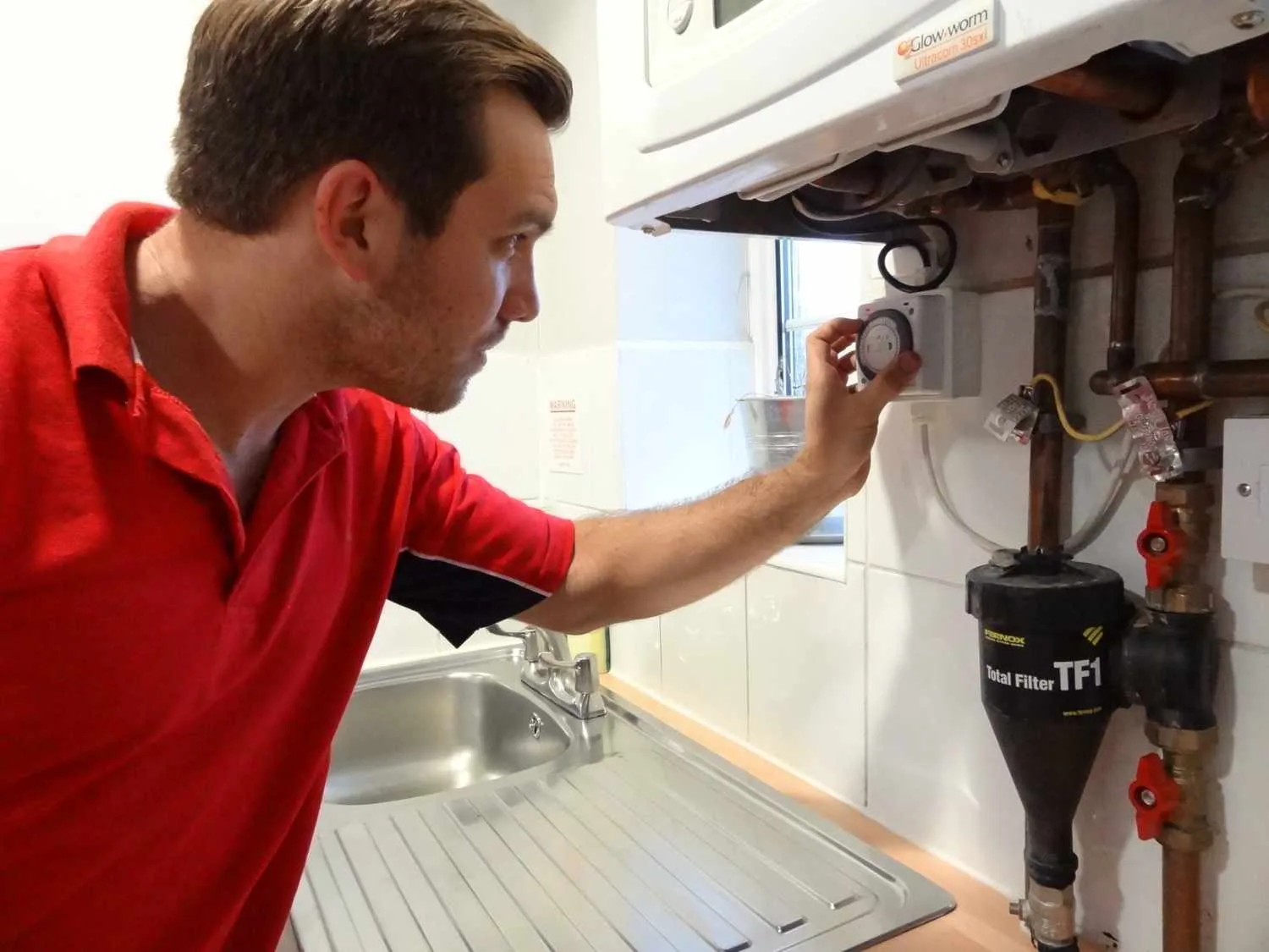 Chelsea Plumbers 247 boiler repair engineer working on a boiler in Chelsea